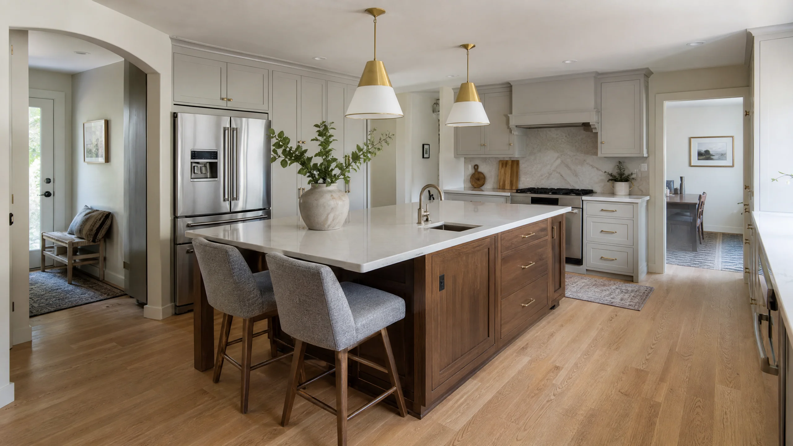 Kitchen islands done right in a Holladay home: a walnut island with seating for three, a prep sink and clear walkways on every side